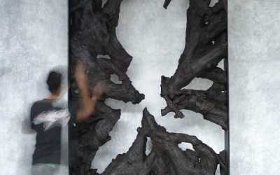 25 Large teak root sculpture in iron frame